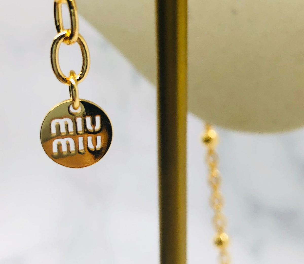 MIU MIU Gold Tone Monogram Necklace - Pre owned