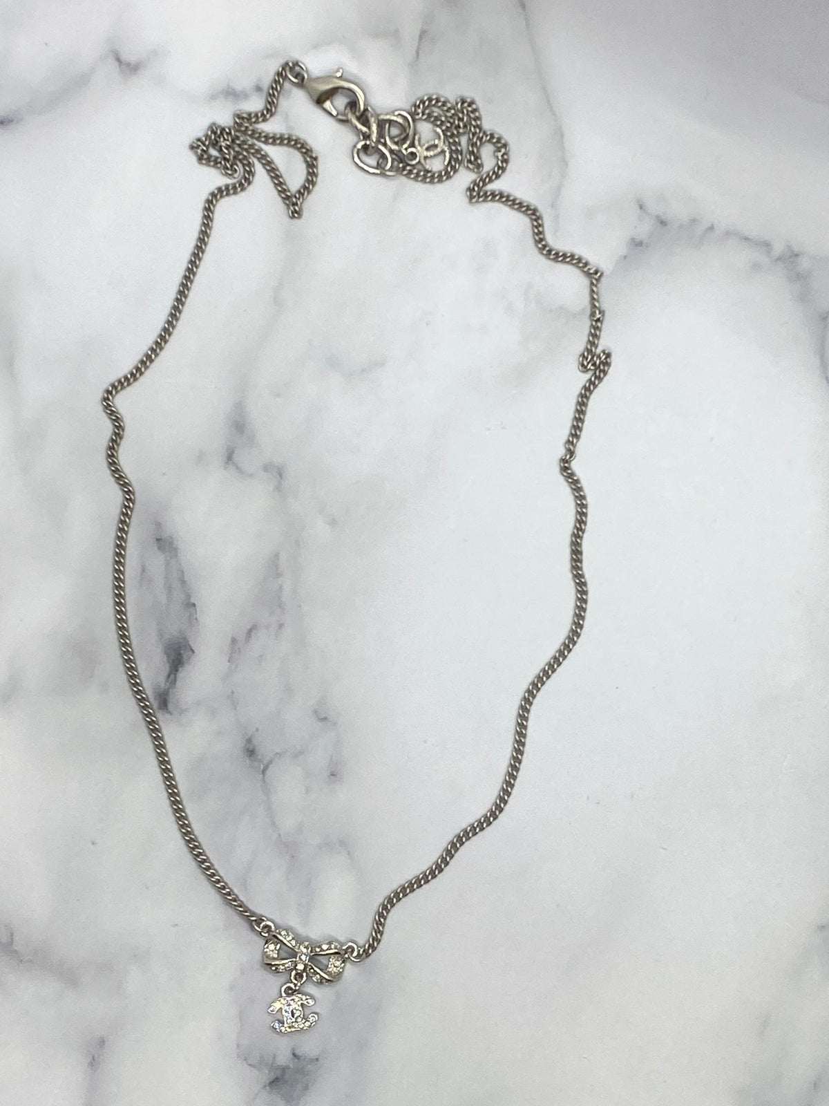 Auth CHANEL CC Silver Rhinestone Bow Necklace - USED