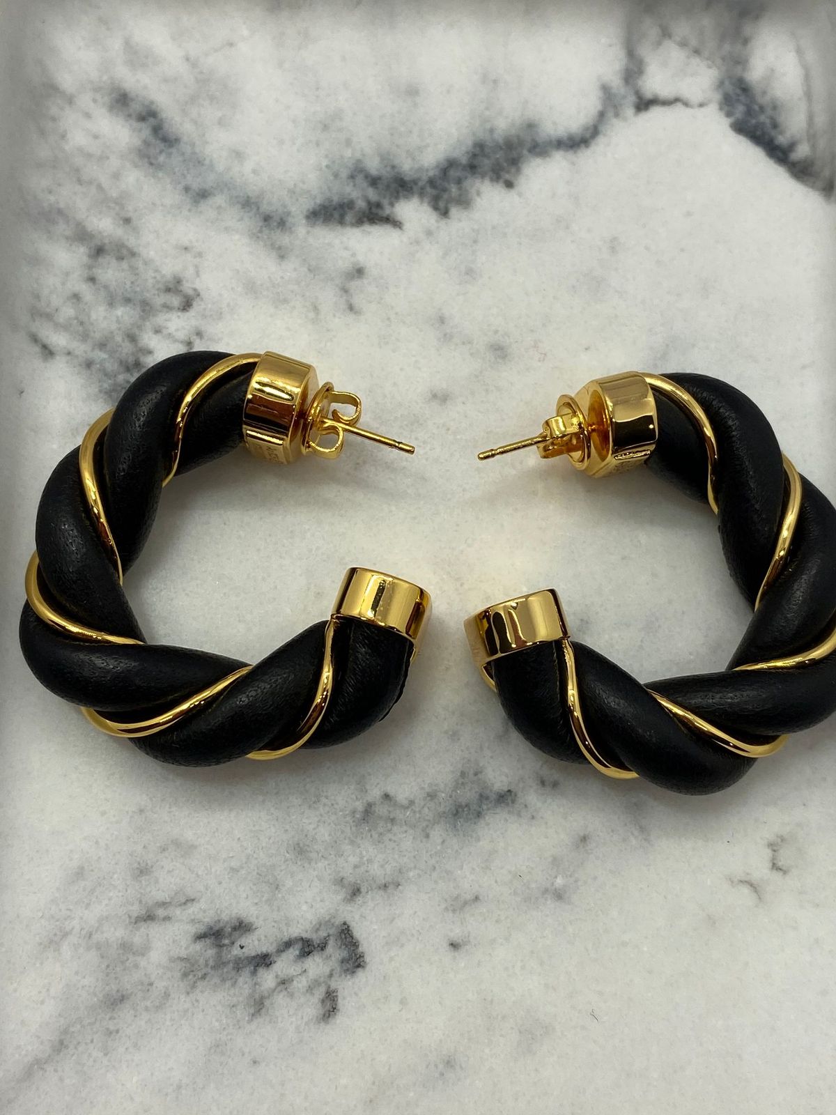 BOTTEGA VENETA Black Leather Gold Tone Twist Earrings - Pre owned