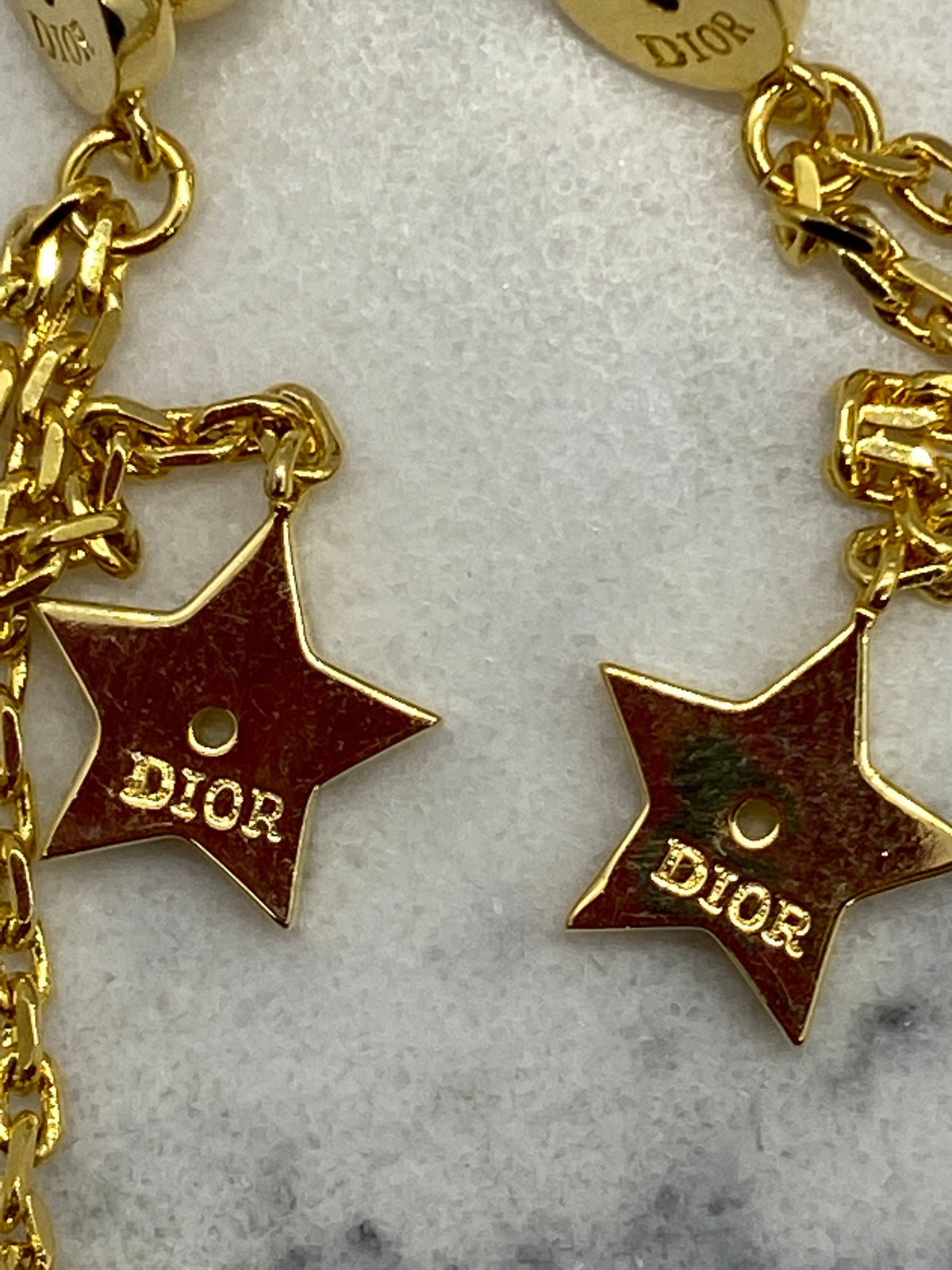 CHRISTIAN DIOR CD Gold Tone Star Pendant Earrings - Pre owned