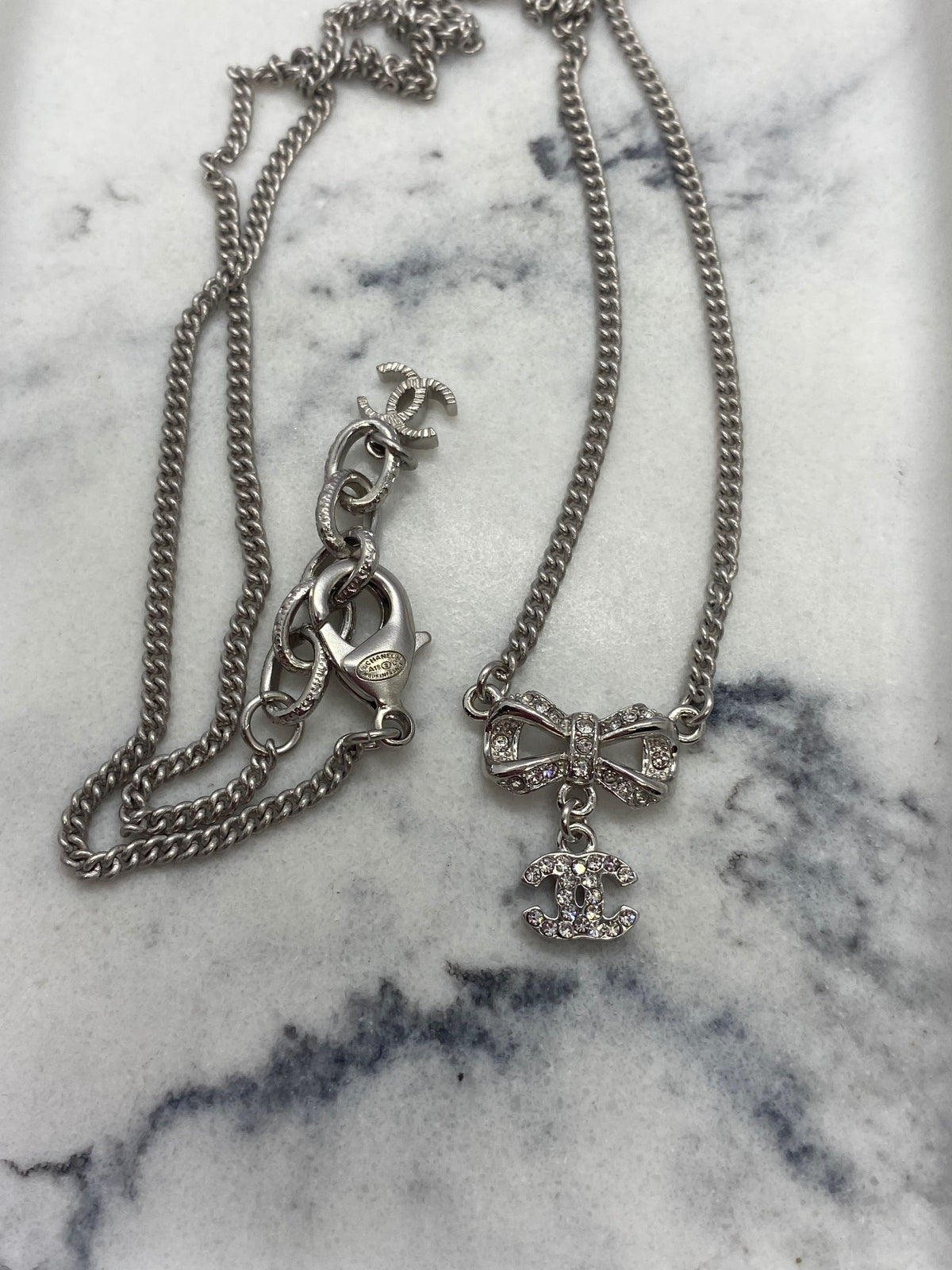 Auth CHANEL CC Silver Rhinestone Bow Necklace - USED