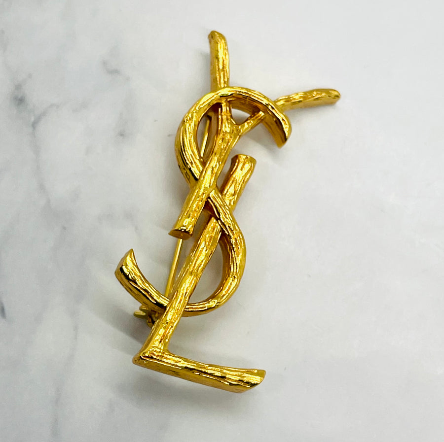 YSL YVES SAINT LAURENT Gold Tone Monogram Brooch Pin - Pre owned