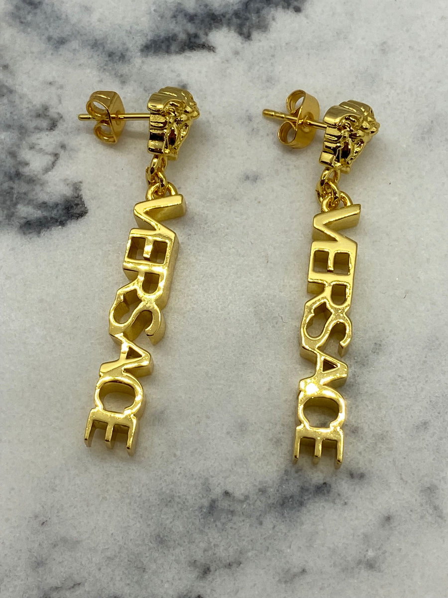 VERSACE Gold Tone Monogram Pendant Earrings - Pre owned