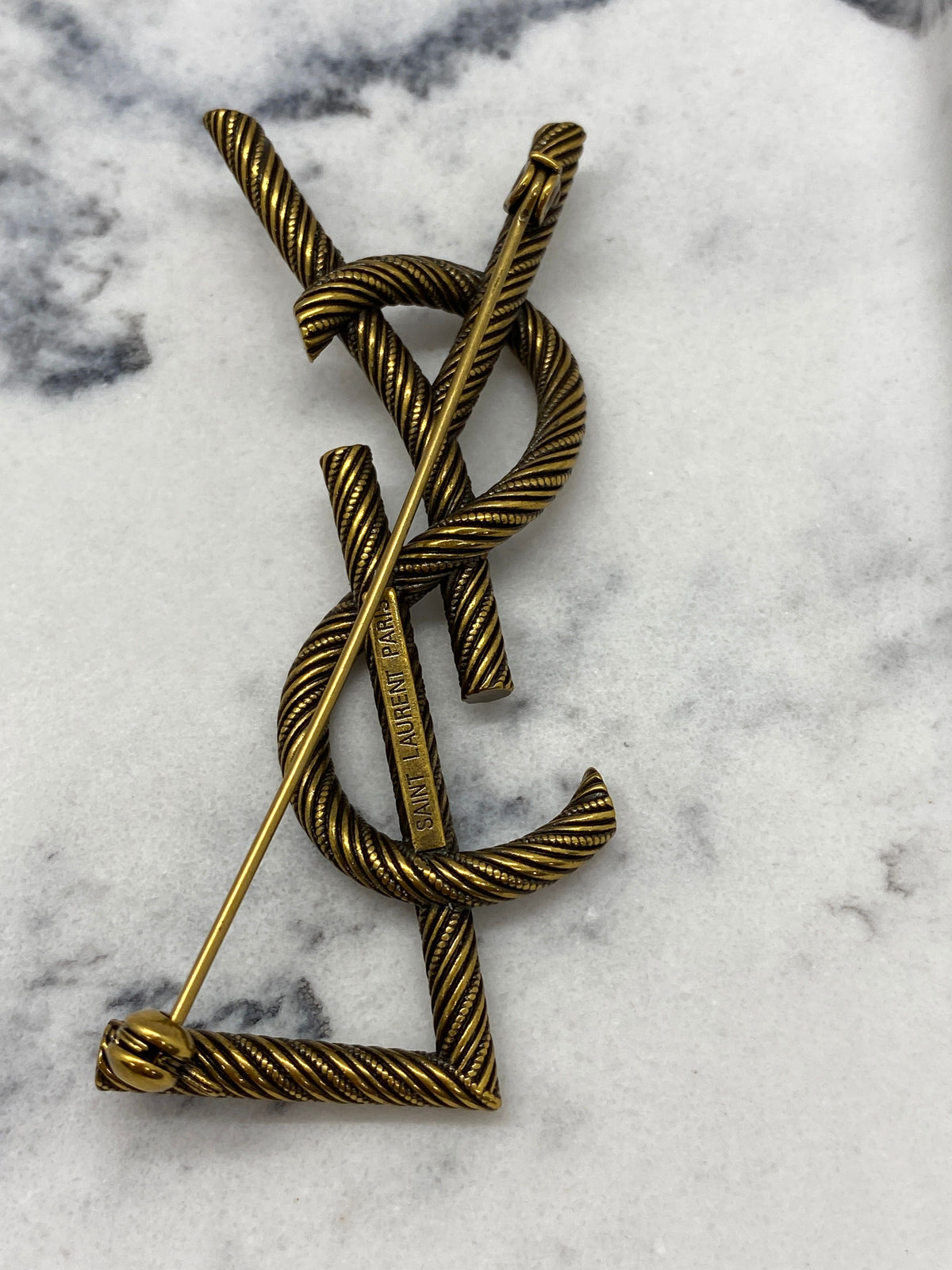 YVES SAINT LAURENT Brass Tone Monogram Brooch Pin - Pre owned