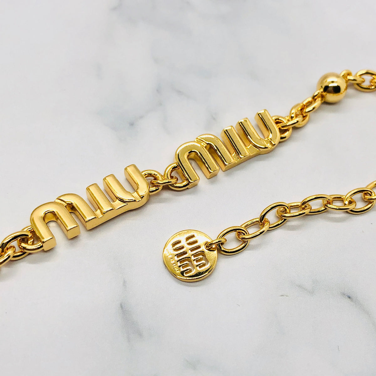 MIU MIU Gold Tone Monogram Bracelet - Pre owned