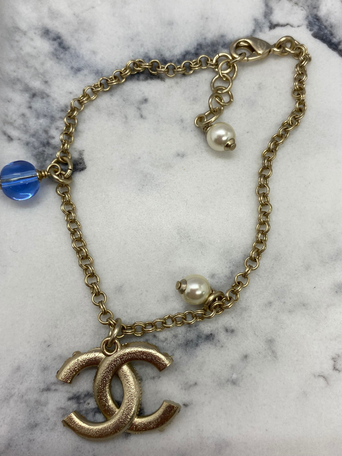 CHANEL CC Gold Tone Blue Rhinestone Charm Bracelet - Pre owned