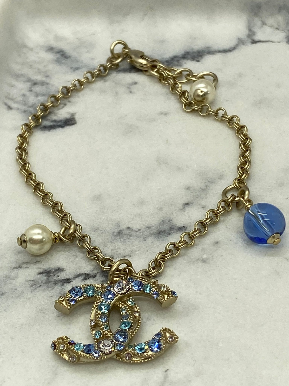 CHANEL CC Gold Tone Blue Rhinestone Charm Bracelet - Pre owned