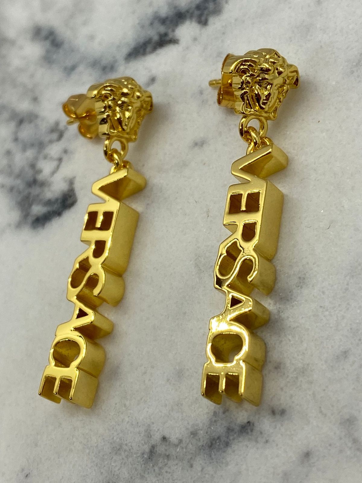 VERSACE Gold Tone Monogram Pendant Earrings - Pre owned