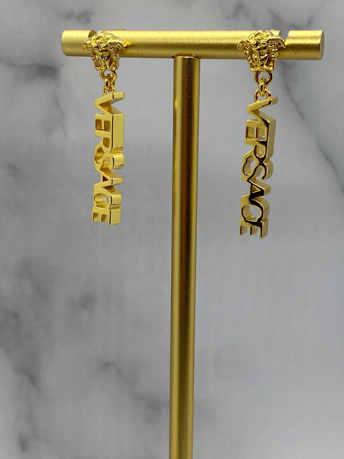 VERSACE Gold Tone Monogram Pendant Earrings - Pre owned