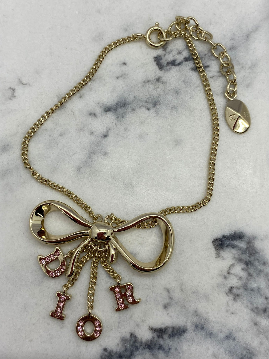 CHRISTIAN DIOR Silver Tone Ribbon Charm Bracelet - USED
