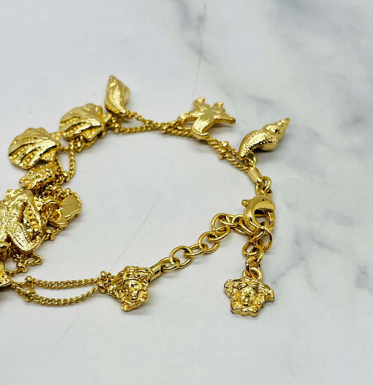 VERSACE Shells Charms Cruise Gold Tone Bracelet - Pre owned