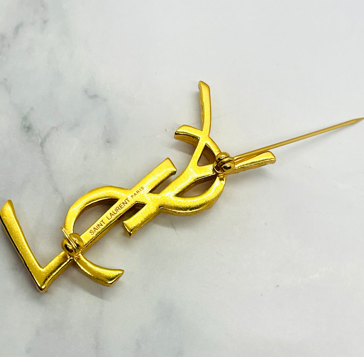 YSL YVES SAINT LAURENT Gold Tone Monogram Brooch Pin - Pre owned