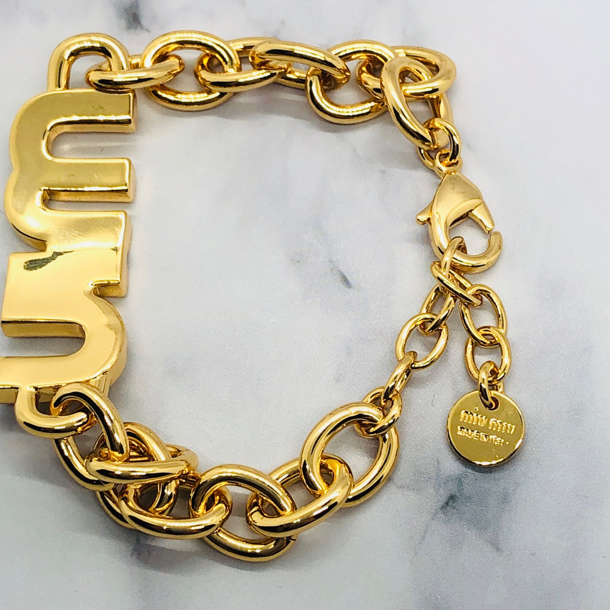 MIU MIU Gold Tone Monogram Bracelet - Pre owned