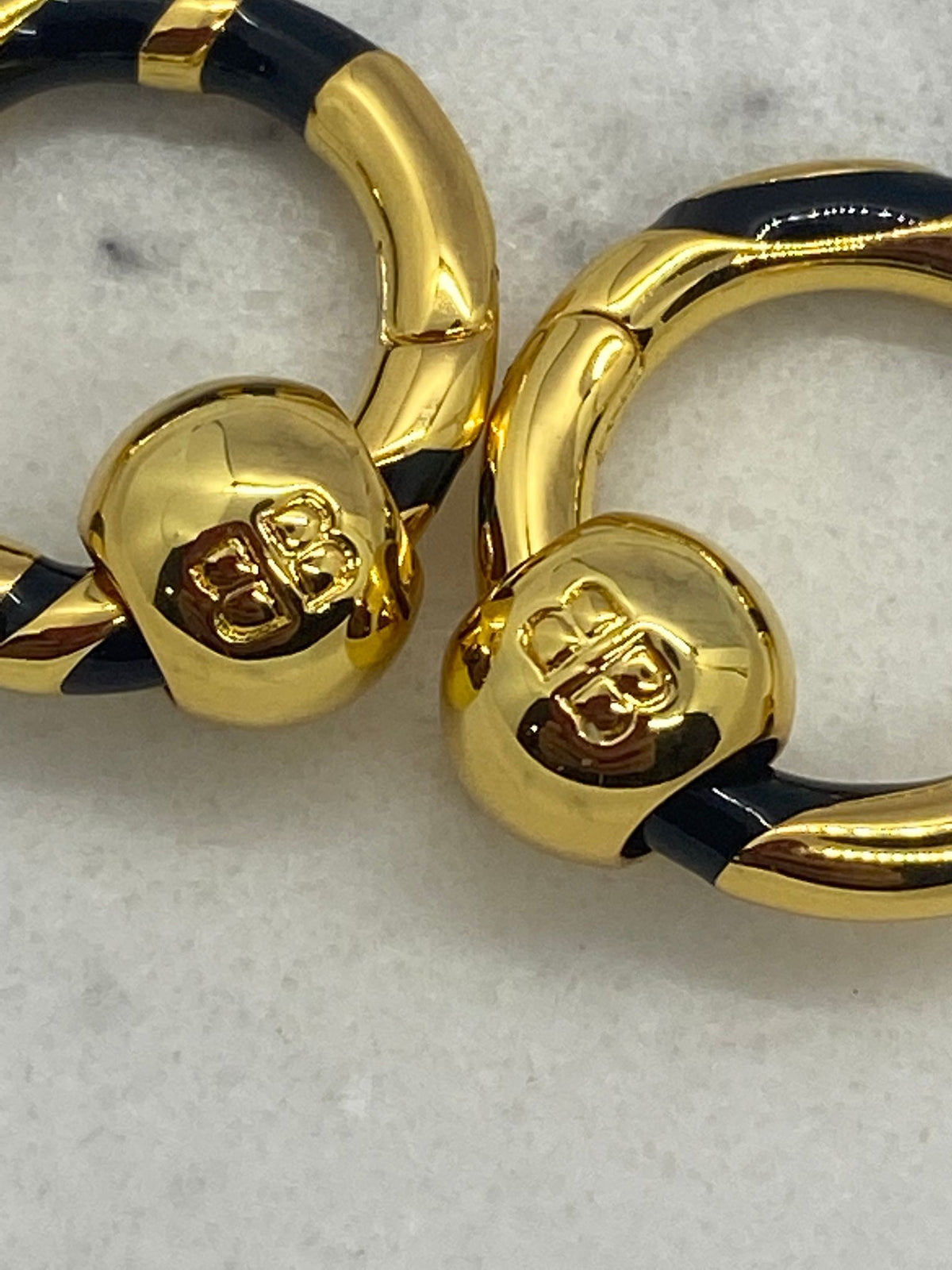 BALENCIAGA BB Gold Tone Black Strip Hoop Earrings - Pre owned