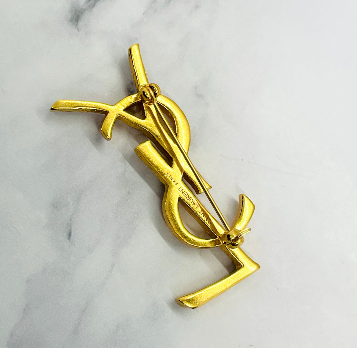 YSL YVES SAINT LAURENT Gold Tone Monogram Brooch Pin - Pre owned