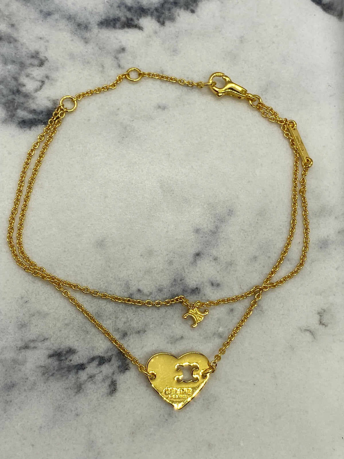 CELINE Gold Tone Heart Monogram Charm Bracelet - Pre owned