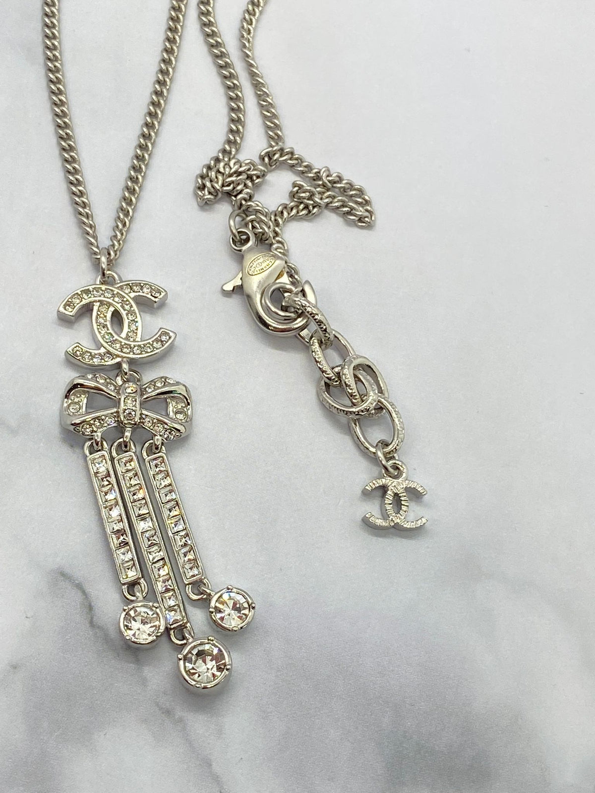 CHANEL CC Silver Tone Rhinestone Bow Necklace - Pre owned