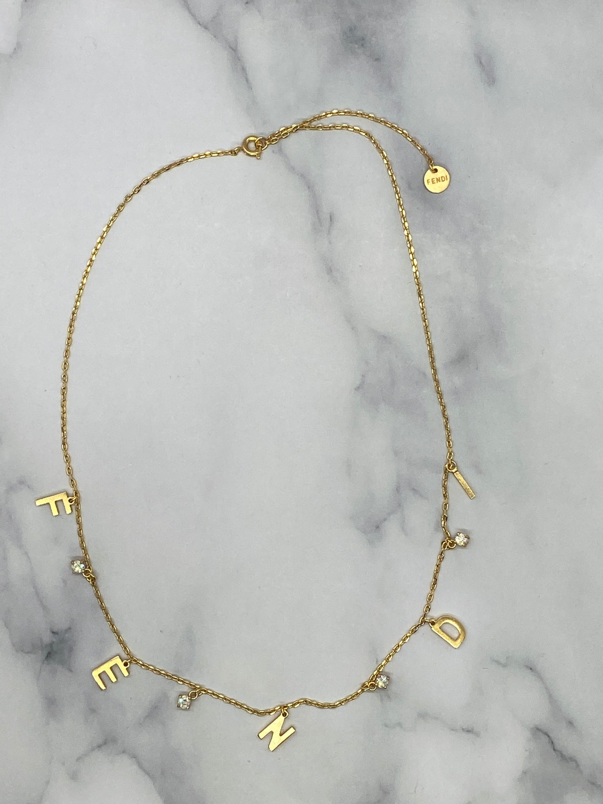 FENDI Gold Tone Rhinestone Monogram Necklace - Pre owned