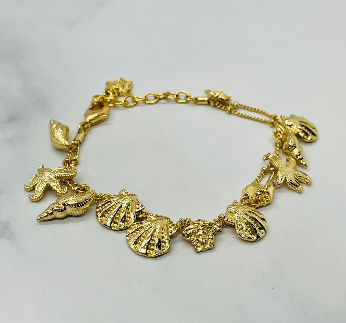VERSACE Shells Charms Cruise Gold Tone Bracelet - Pre owned