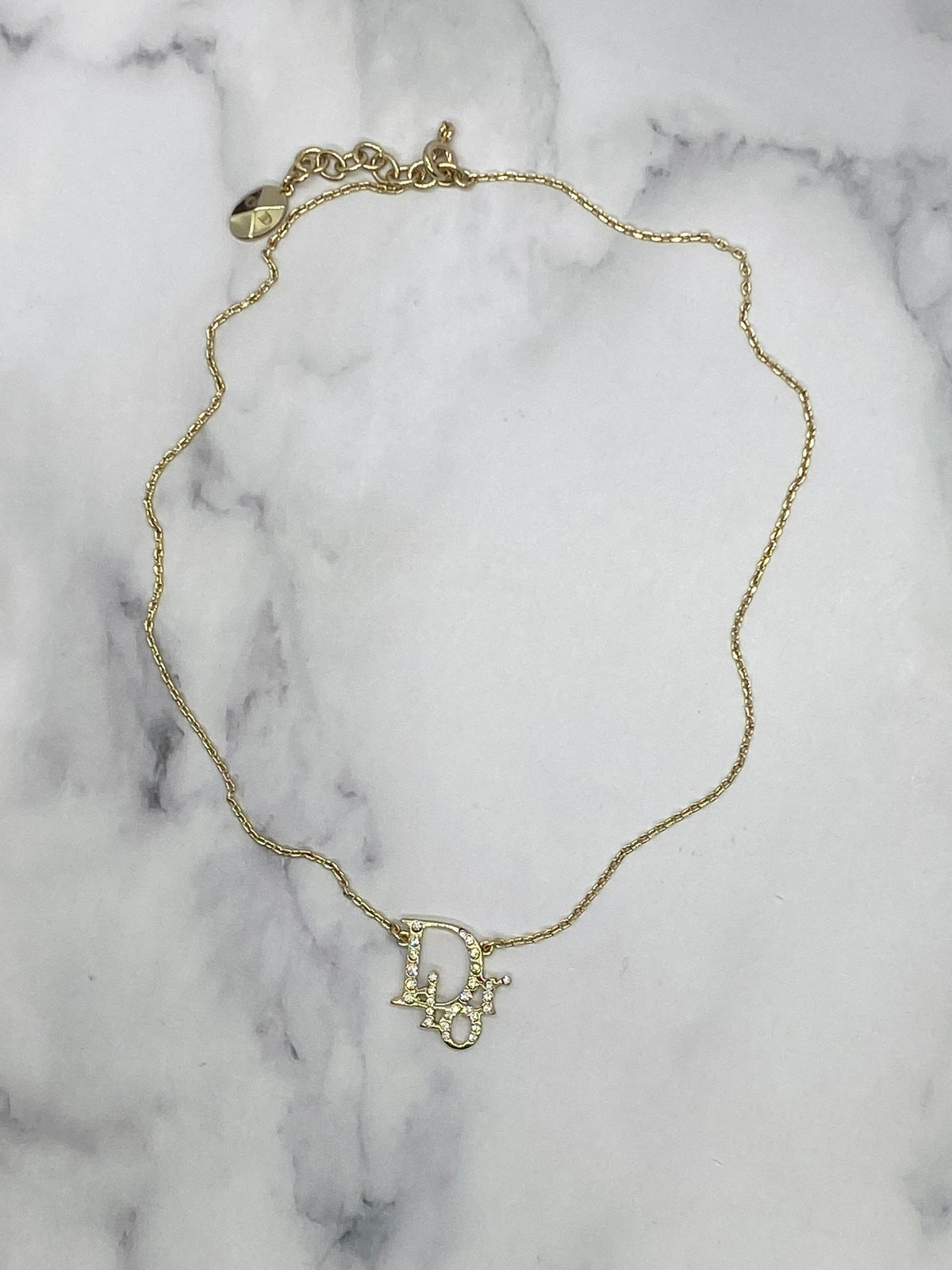 CHRISTIAN DIOR Silver Tone Rhinestone Monogram Necklace- Pre owned