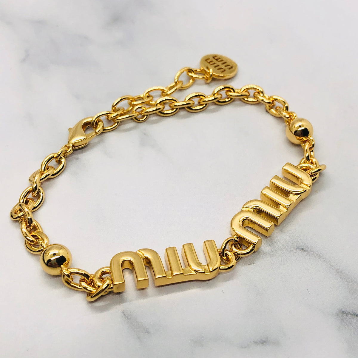 MIU MIU Gold Tone Monogram Bracelet - Pre owned