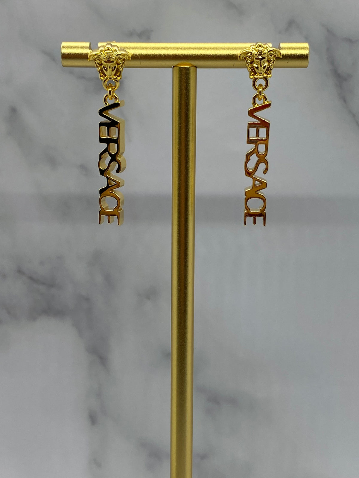 VERSACE Gold Tone Monogram Pendant Earrings - Pre owned