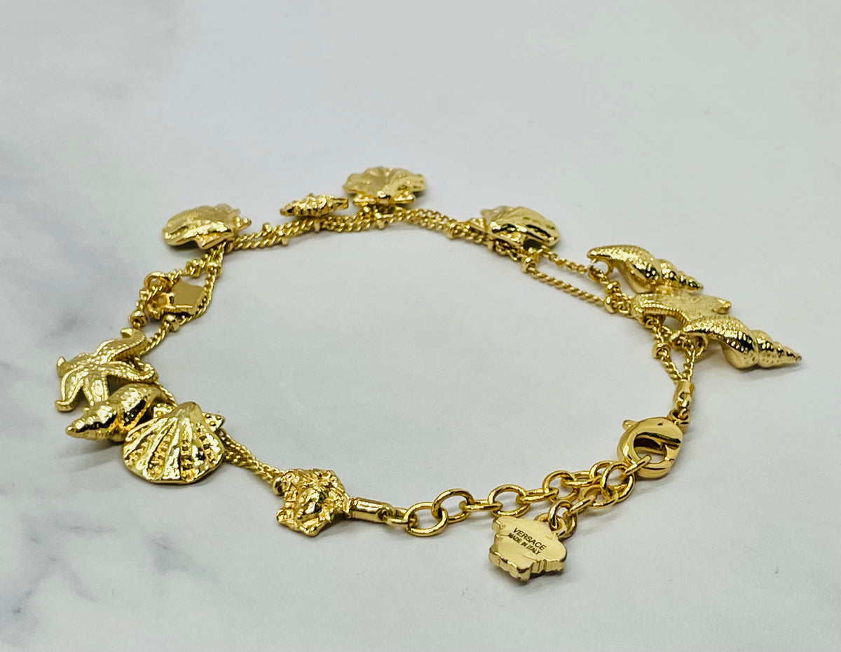 VERSACE Shells Charms Cruise Gold Tone Bracelet - Pre owned