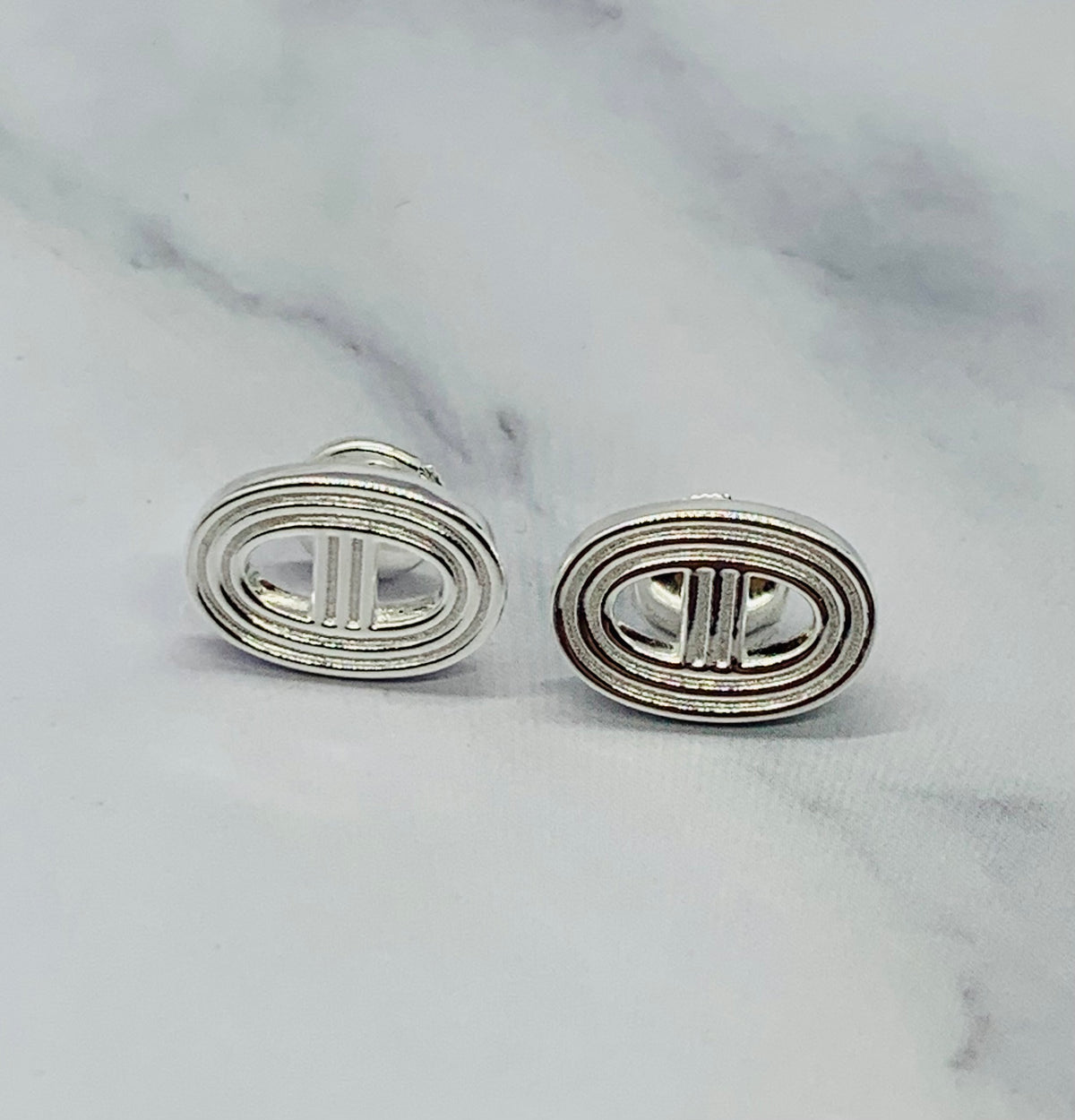 HERMES Monogram Silver Tone Earrings - Pre owned