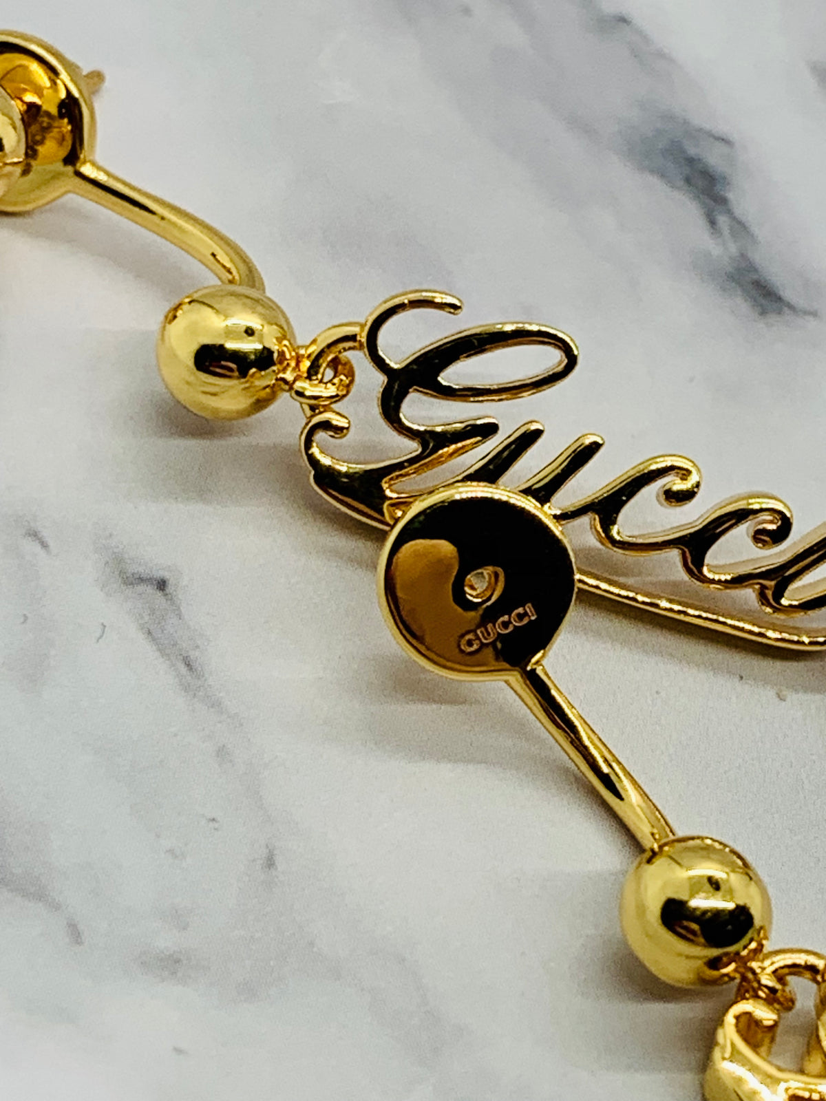 GUCCI Signature Gold Tone Pendant Earrings - Pre owned