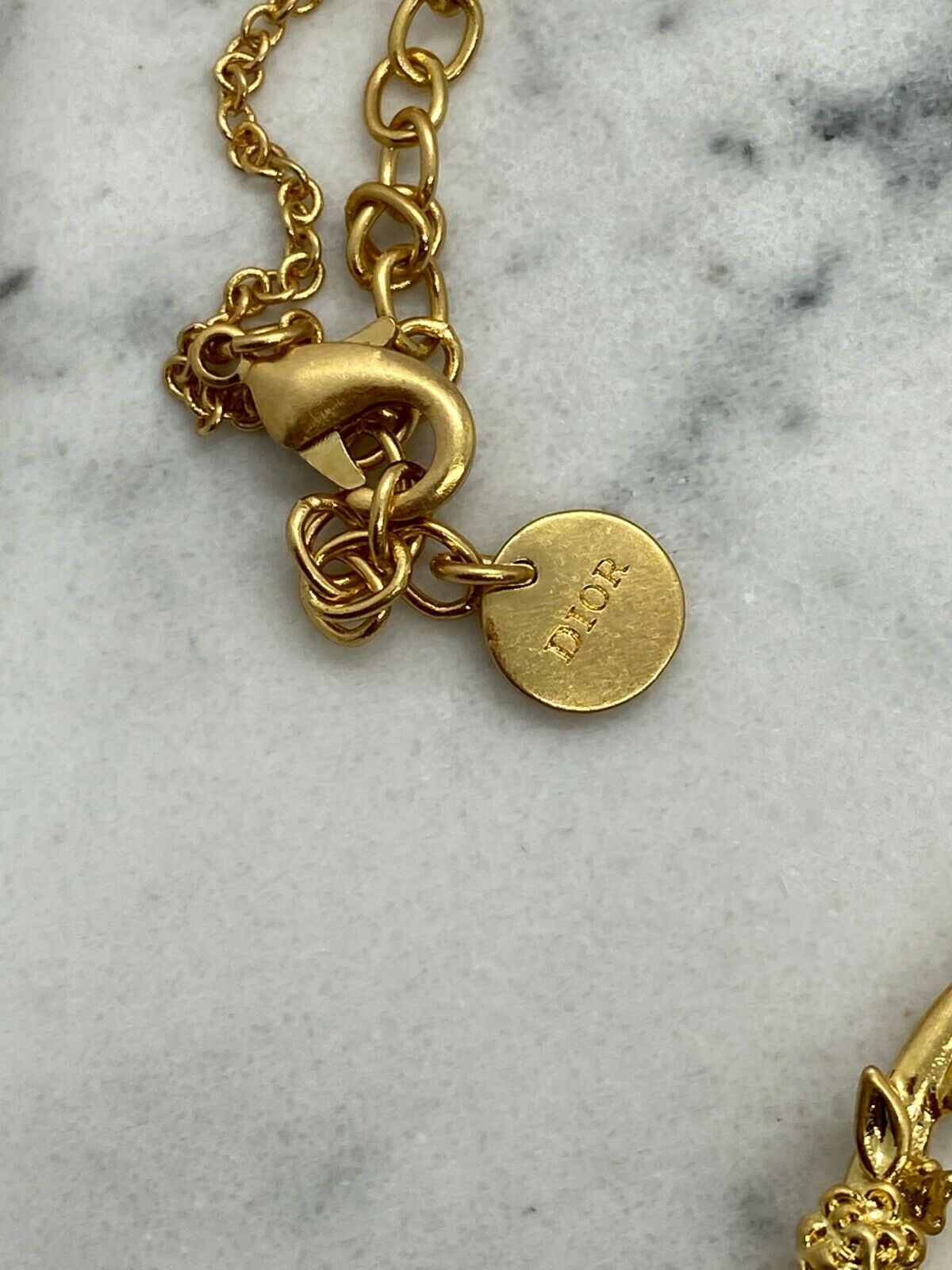 CHRISTIAN DIOR Gold Tone Wing Charm Necklace - Pre owned