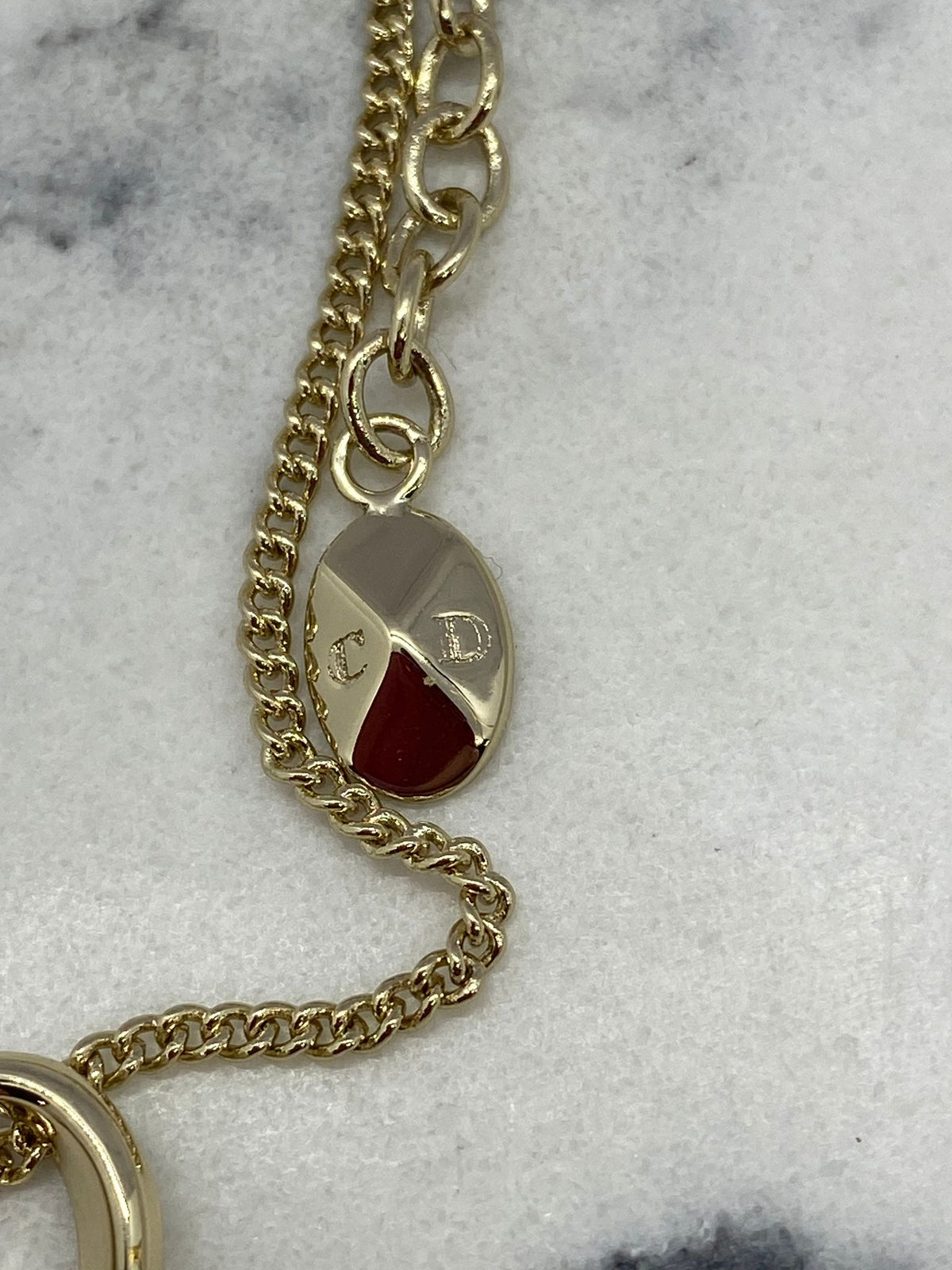 CHRISTIAN DIOR Silver Tone Ribbon Charm Bracelet - USED