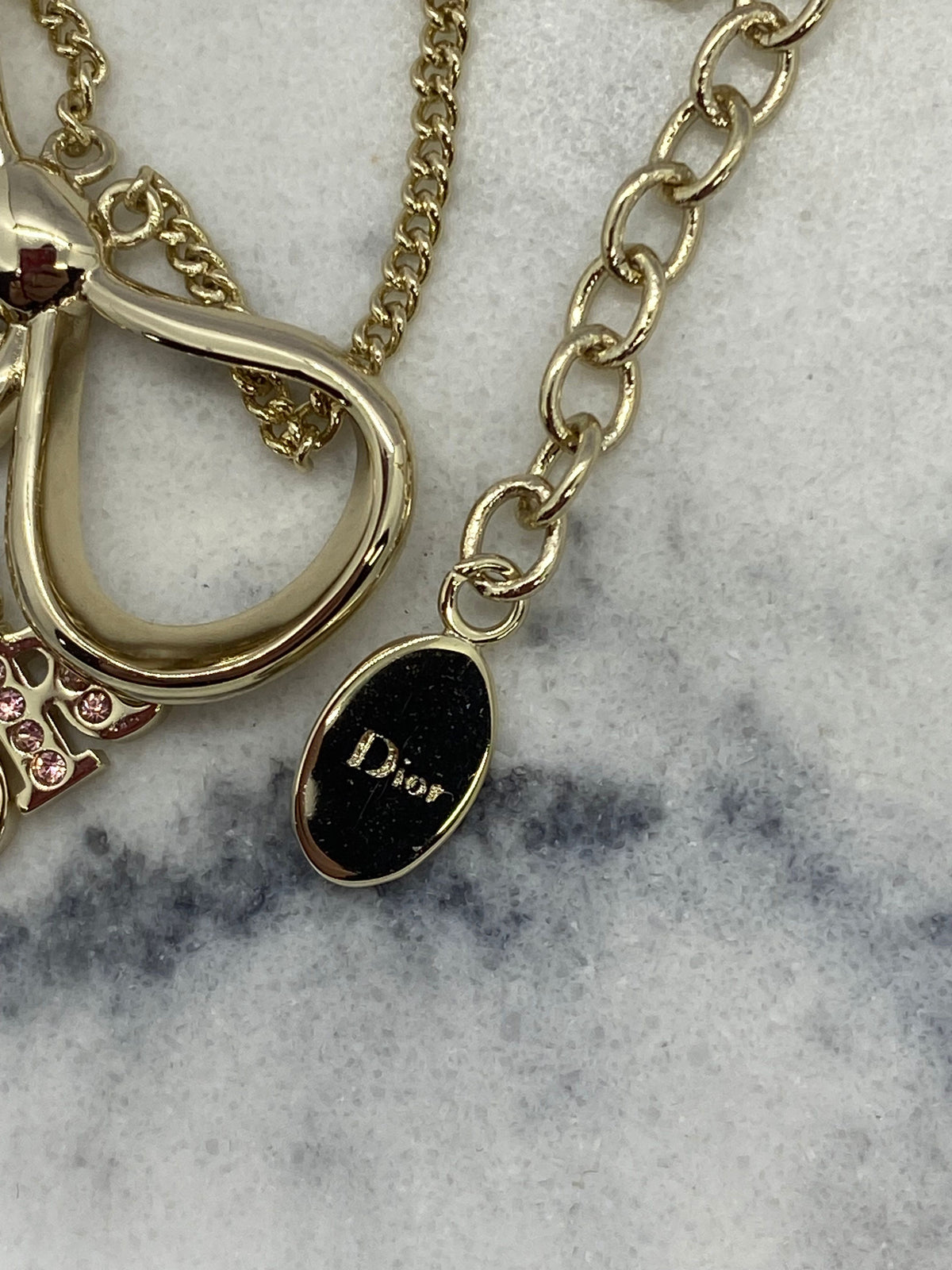 CHRISTIAN DIOR Silver Tone Ribbon Charm Bracelet - USED